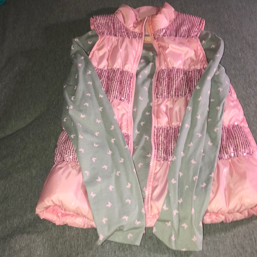 Light pink vest and gray shirt with butterflies